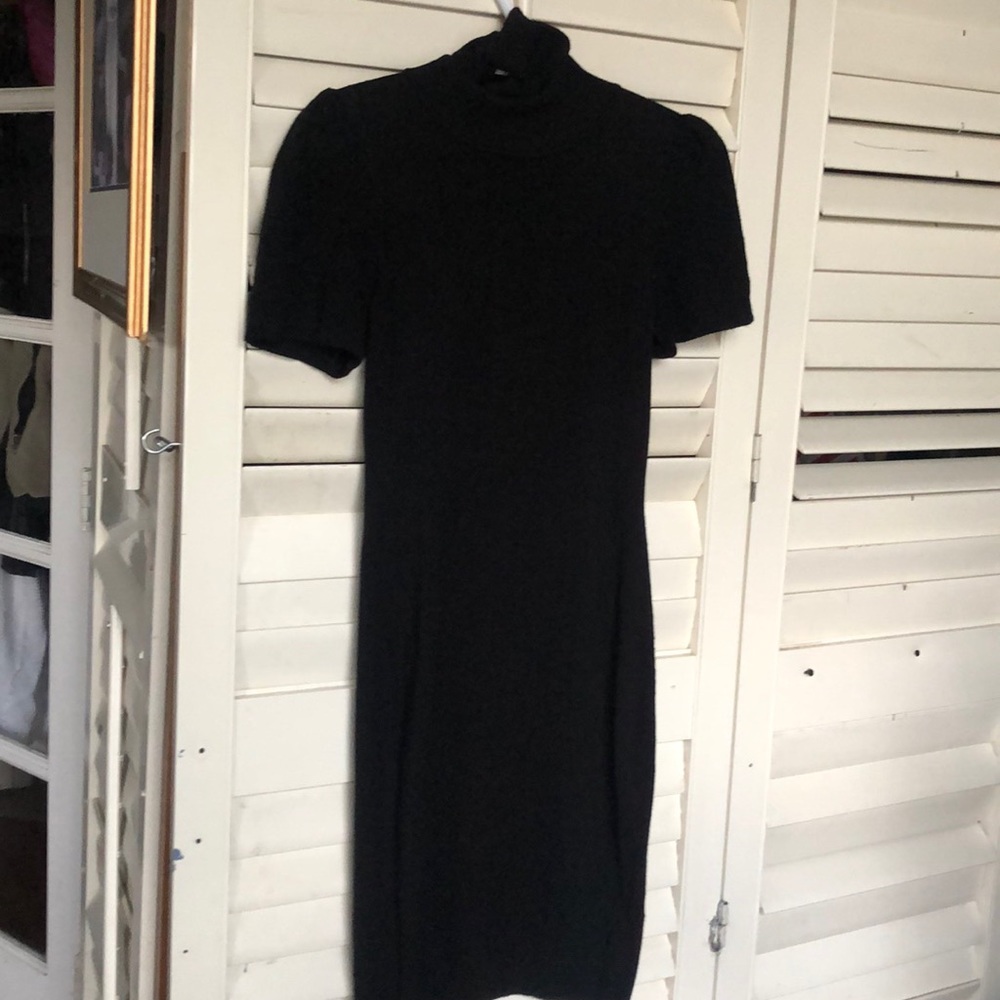 Black sweater dress with turtleneck.